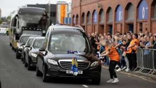 Jimmy Bell's funeral cortege passes by Ibrox