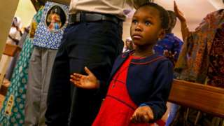 Girl praying in church