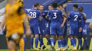 Leicester's players celebrate scoring against Wolves in the Premier League