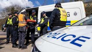 Police officers arrest a climate change protestor in Thurrock
