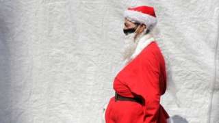 A volunteer characterized as Santa Claus to deliver food, toys and blankets to street populations and people at risk in Mexico City