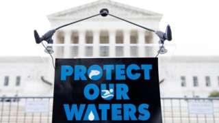 A rally sign for Clean Water Act outside of Supreme Court