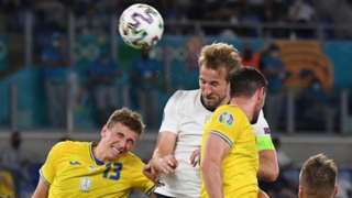 Harry Kane heads the ball against Ukraine