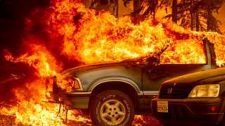 The Dixie Fire burns a car