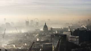 Smoggy rooftop view of London