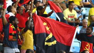 Angola fans celebrating in a crowd