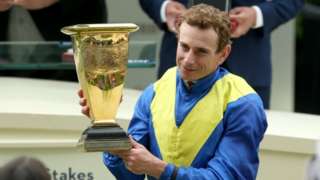 Ryan Moore celebrates winning the Diamond Jubilee Stakes on Dream Of Dreams