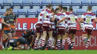 Wigan celebrate the try from Sam Powell