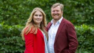 King Willem-Alexander of the Netherlands (R) and Princess Amalia pose during the summer photo session at Huis ten Bosch Palace in The Hague, on July 16, 2021