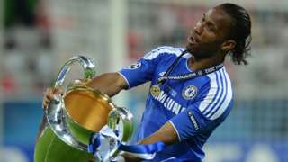 Chelsea striker Didier Drogba celebrates with the Champions League trophy in 2012