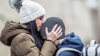 A woman and child refugee