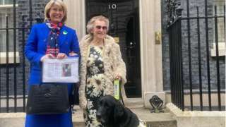 Jill Allen-King with Jagger and MP Anna Firth outside No 10 Downing Street