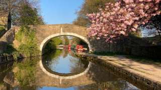 The Leeds and Liverpool Canal in the village of Kildwick in North Yorkshire