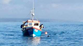 Fishing vessel alongside Nathan Rogers