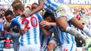 Huddersfield players celebrate with goalscorer Tom Ince