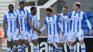 Colchester players celebrate Courtney Senior’s goal