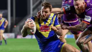 Warrington's Daryl Clark scores his first try against Huddersfield