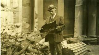 An official in the ruins of the Four Courts