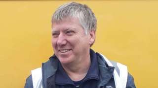 Philip Horner in front of a yellow background