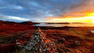 Sunset over the hamlet of Altandhu and the summer isles.