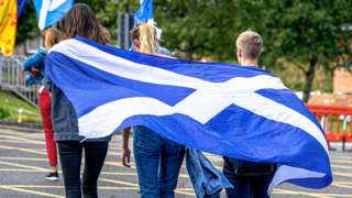 File photo of people with a flag during a Scottish independence march through Perth on 7 July 2019