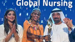 Anna Qabale Duba receives the award