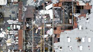 Roof damage to a building after a tornado.
