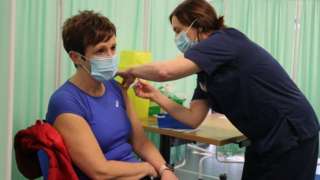 woman receiving vaccine