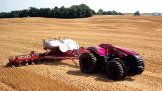 Driverless tractor tilling in field
