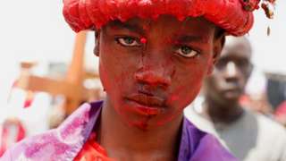Kenyan Catholic devotee Joseph Browlins portrays Jesus Christ during a re-enactment of the crucifixion.