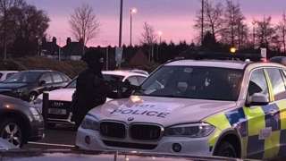 Armed police officer at scene