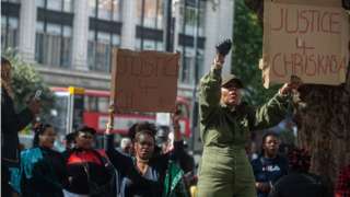 Protestors outside of Brixton Police station