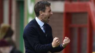 Interim Dundee boss Neil McCann celebrates his side's third goal