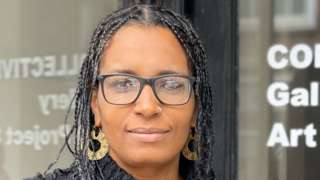 Aisha Adi, an artist from St Albans, Hertfordshire standing by the Collective Gallery, Art Project Space