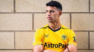 Wolves record signing Matheus Nunes posing for his new club