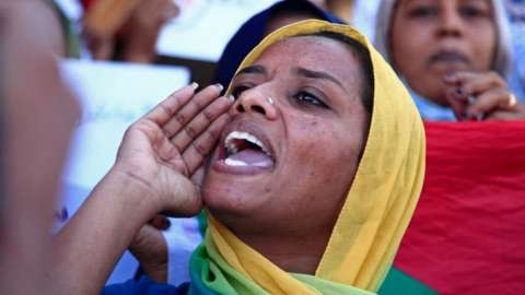 Sudanese women take part in a protest decrying sexual attacks, after the UN said at least 13 women and girls were raped in the recent mass protests against the army, in the twin city Omdurman on December 23, 2021.