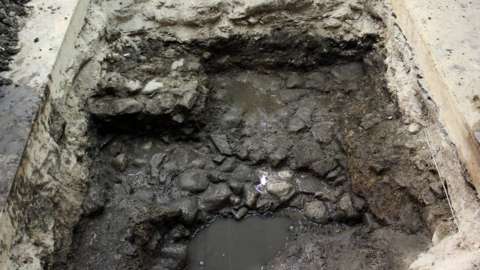 Roman street surface or yard, discovered in a test pit inside the Debenhams building