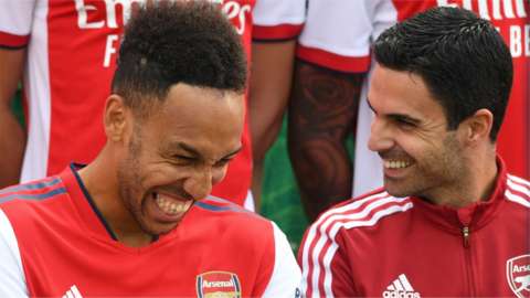 Pierre-Emerick Aubameyang and Mikel Arteta both laugh during photographs at Colney.