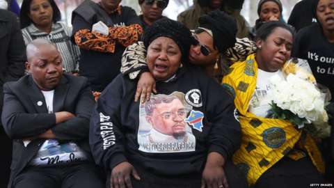Dorcas Lyoya (centre), the mother of Patrick Lyoya, is comforted as she grieves at her son's funeral
