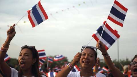 Women wave the Thai flag