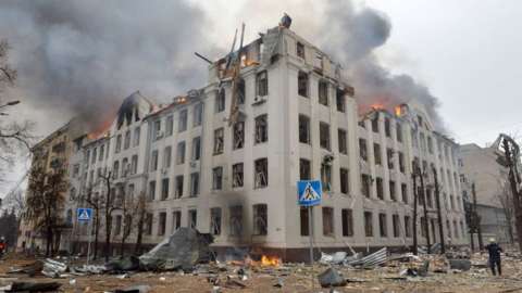 Firefighters work to contain a fire at the Economy Department building of Karazin Kharkiv National University, allegedly hit during recent shelling by Russia