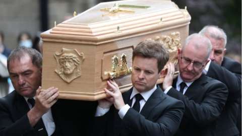 Declan Donnelly carrying the coffin of his brother, Father Dermott Donnelly into St Mary's Cathedral in Newcastle