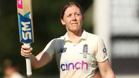 England captain Heather Knight raises her bat to the crowd after hitting an unbeaten century against Australia in the women's Ashes Test