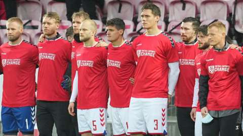 The Danish team wearing shirts stating 'football supports change'