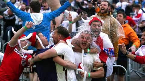 England fans celebrate the Three Lions' fourth goal in Manchester