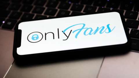 Stock image of the OnlyFans logo on a smartphone