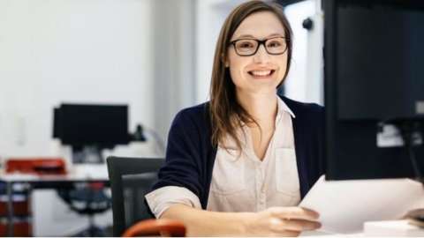 smiling woman in office