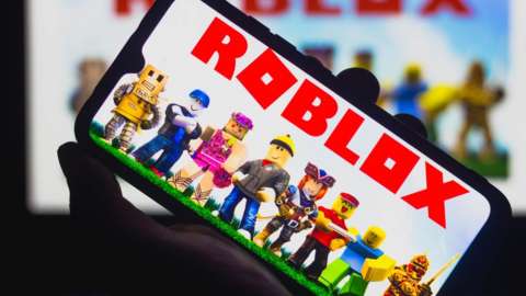 In this photo illustration Roblox logo seen displayed on a smartphone. Roblox is a multiplayer online game and video game creation system.