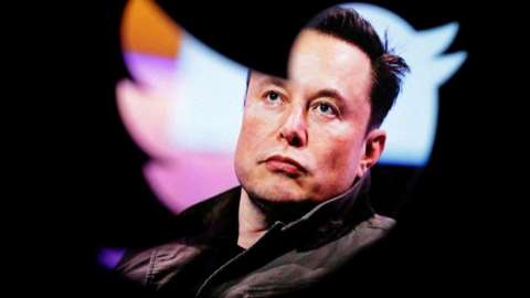 Elon Musk seen through Twitter logo