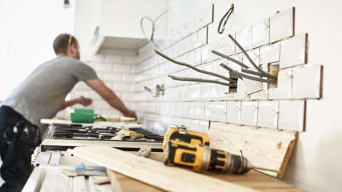 A man carries out household DIY